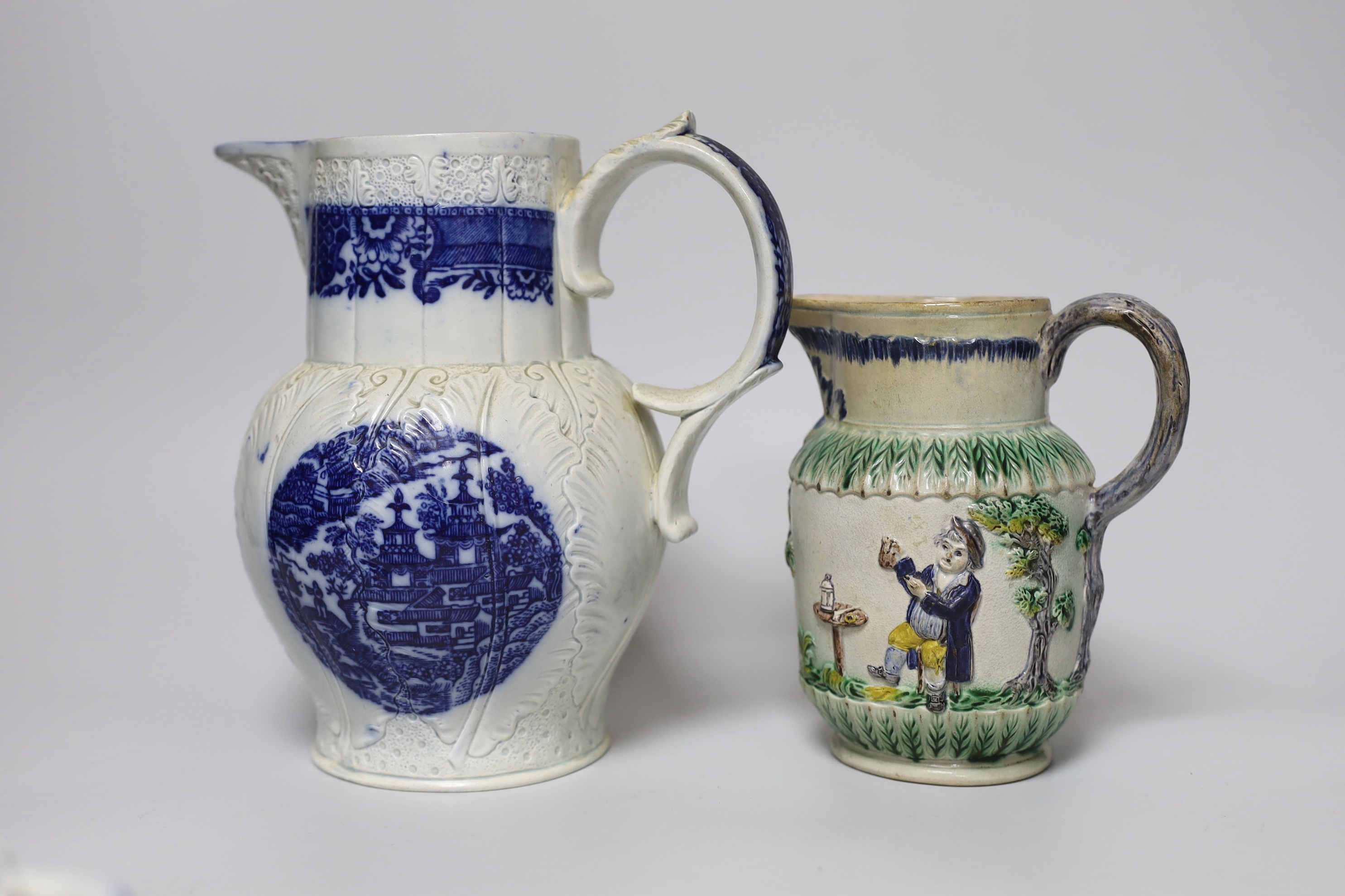 A late 18th century blue and white pearlware jug, a chestnut basket and a Pratt type jug (3), 21.5cm high